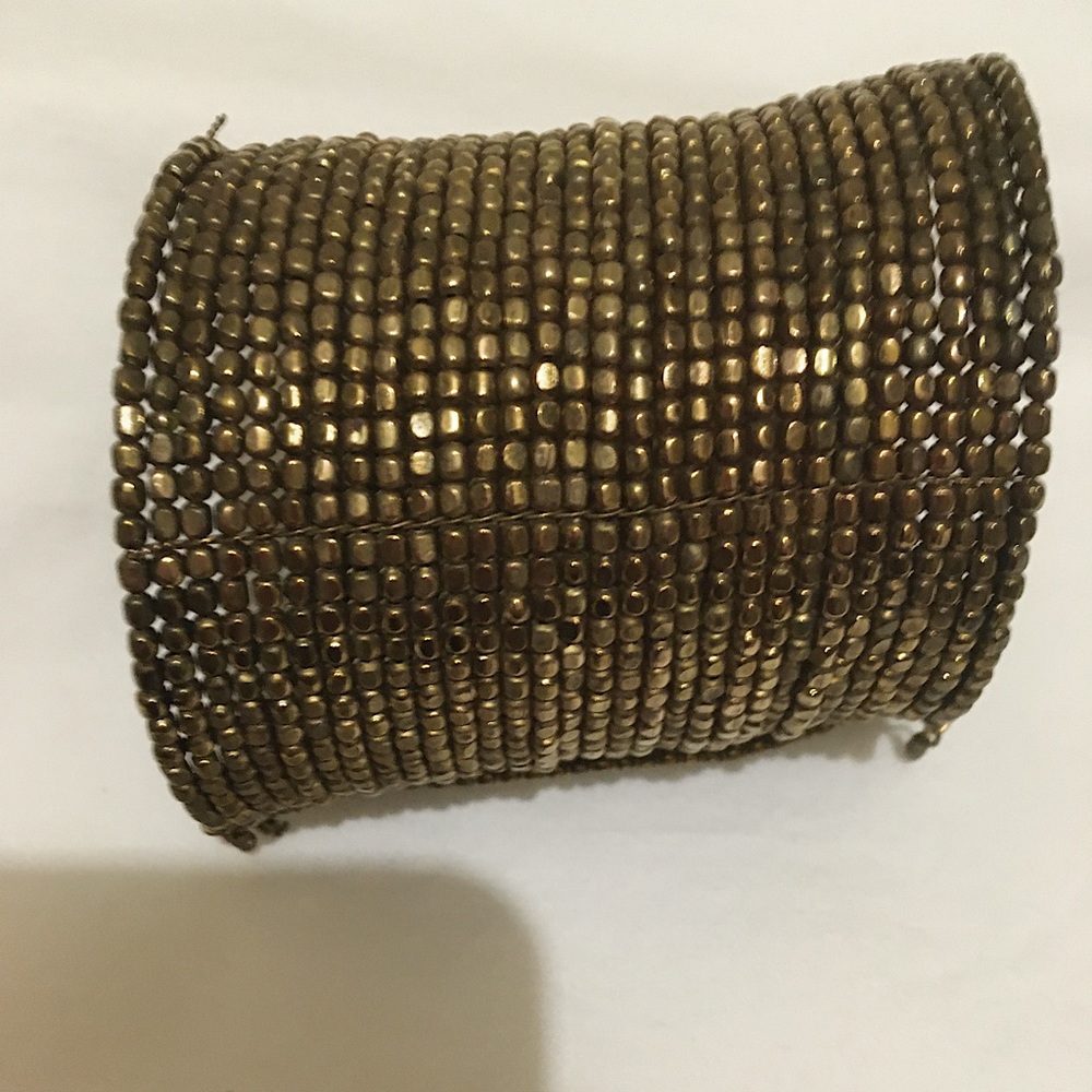Museum Brass bracelet sleeve gold tone Approximately 3 inches.